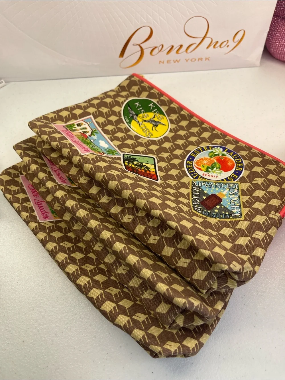 Estee Lauder Brown Patterned Cosmetic Pouch with Travel Patch Accents set of 3!